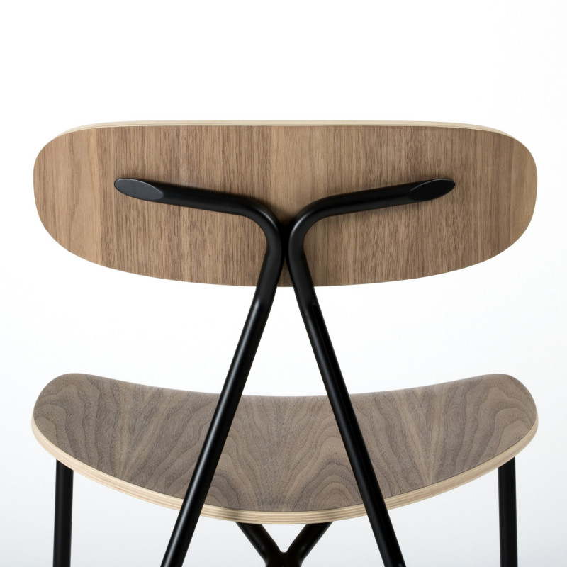 Detail on the Lagoa stacking chair - Walnut and steel